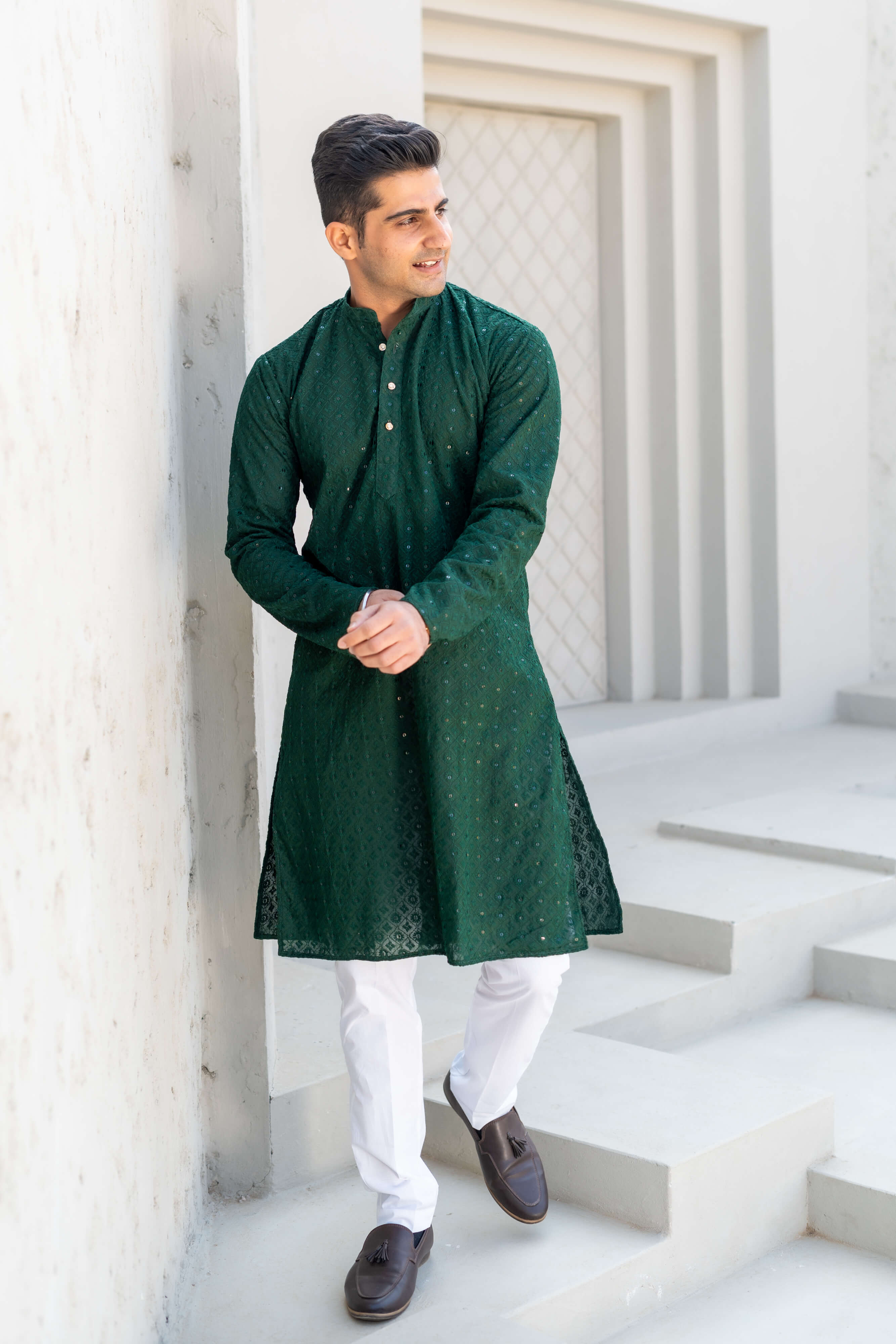 Indian man wearing dark green chikan kari kurta perfect for mehendi ceremony