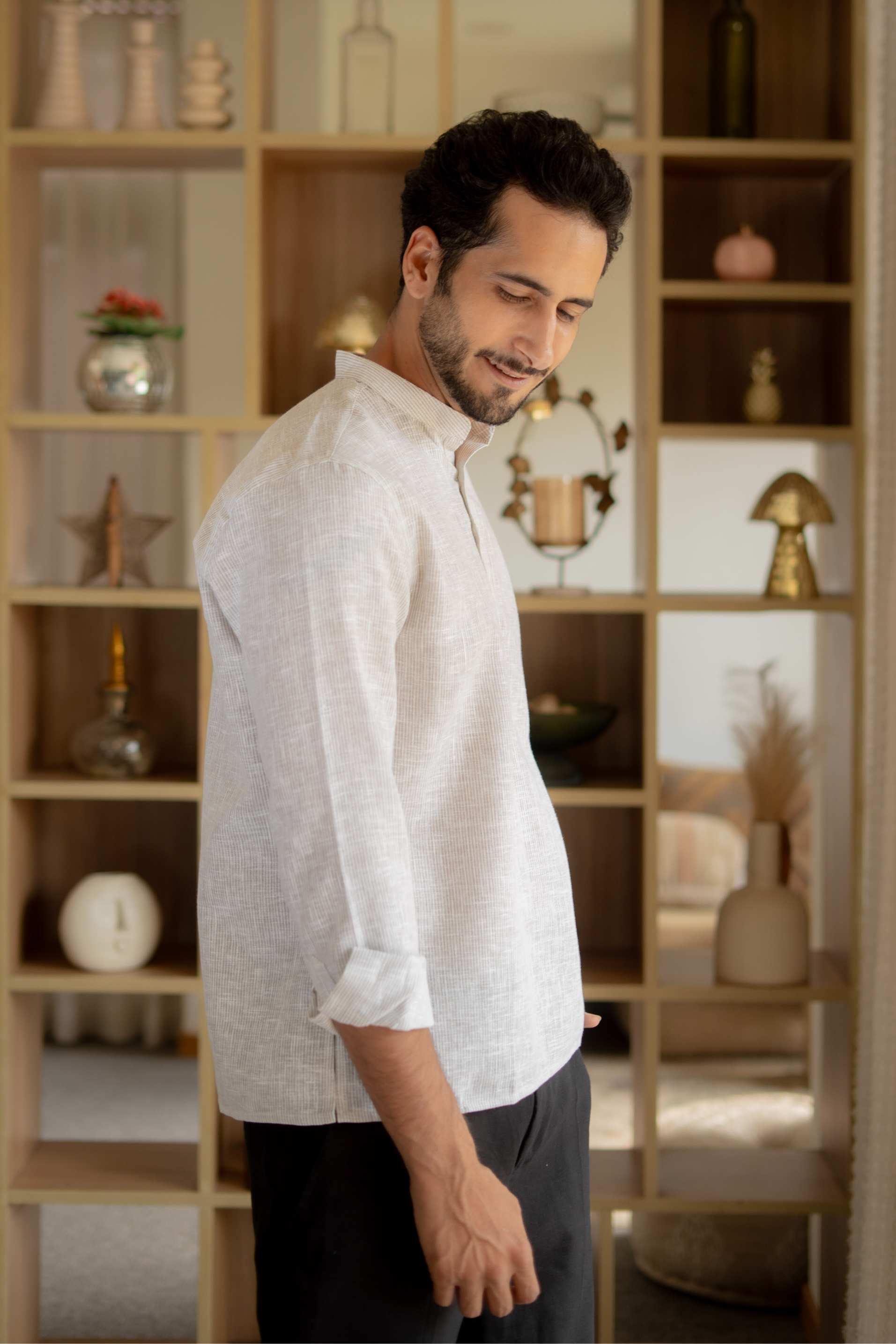 The Off White Yarn Dyed Short Kurta with Blue Weave Design