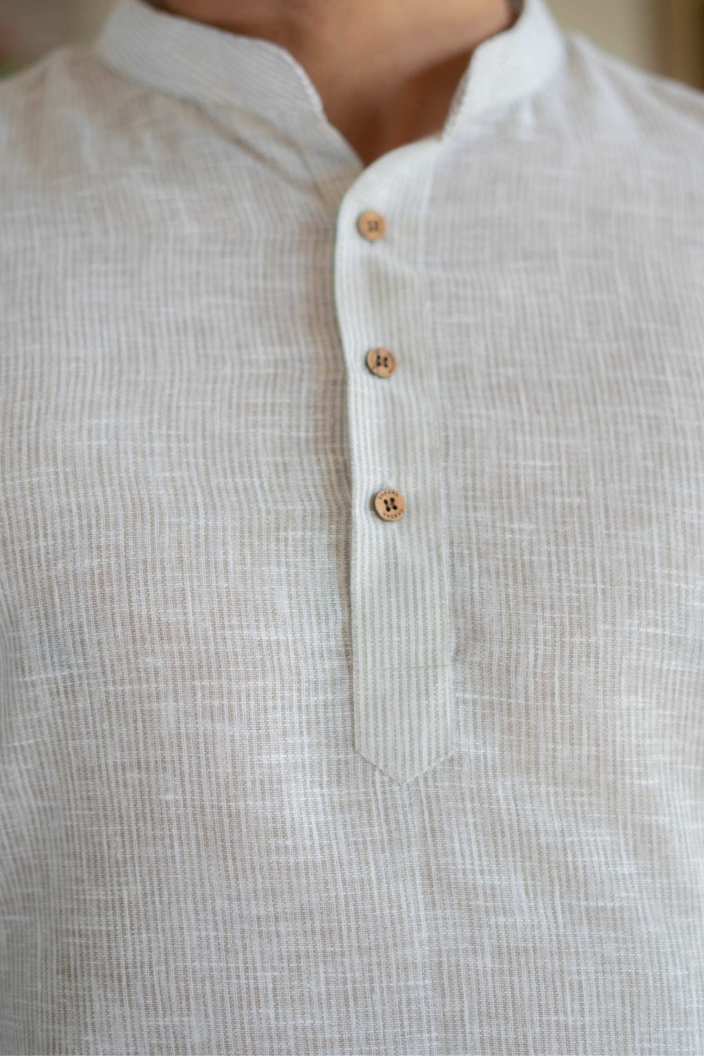The Off White Yard Dyed Short Kurta with Olive Weave Design